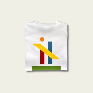 h clothing - flat shot of back of folded white tshirt with graphic of colourful geometric shapes