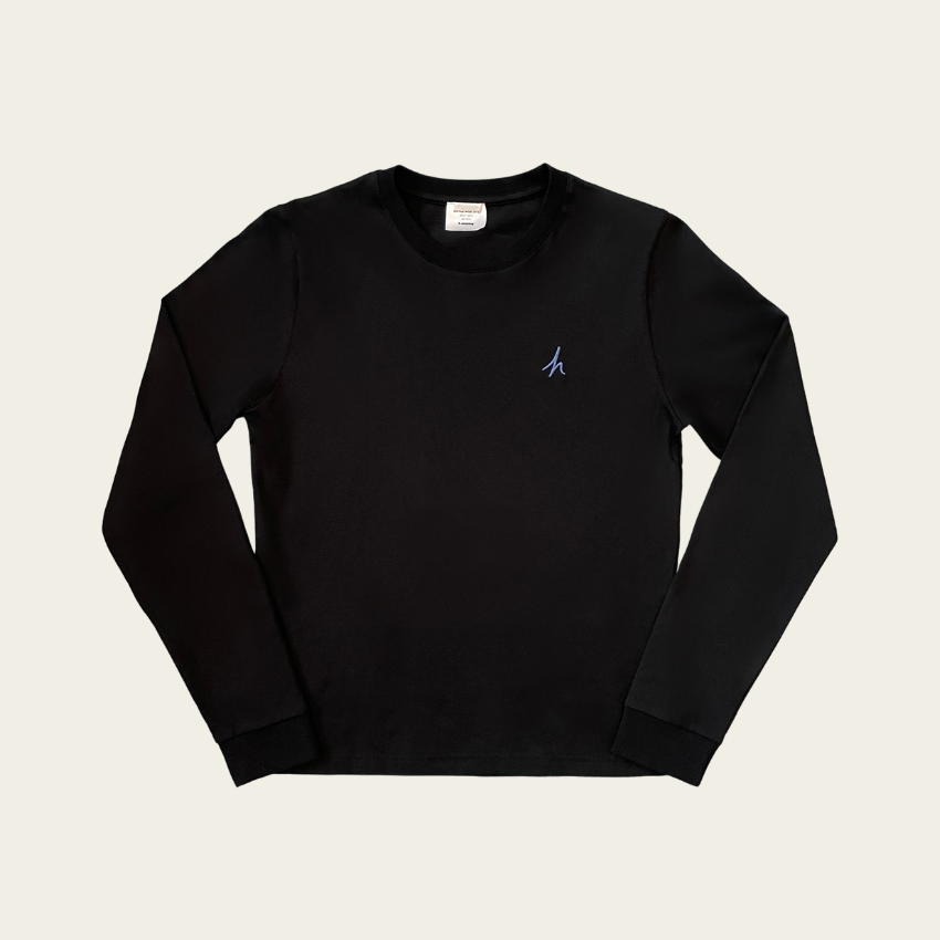 h clothing - flat shot of front of black long sleeved tshirt with blue h logo on left breast