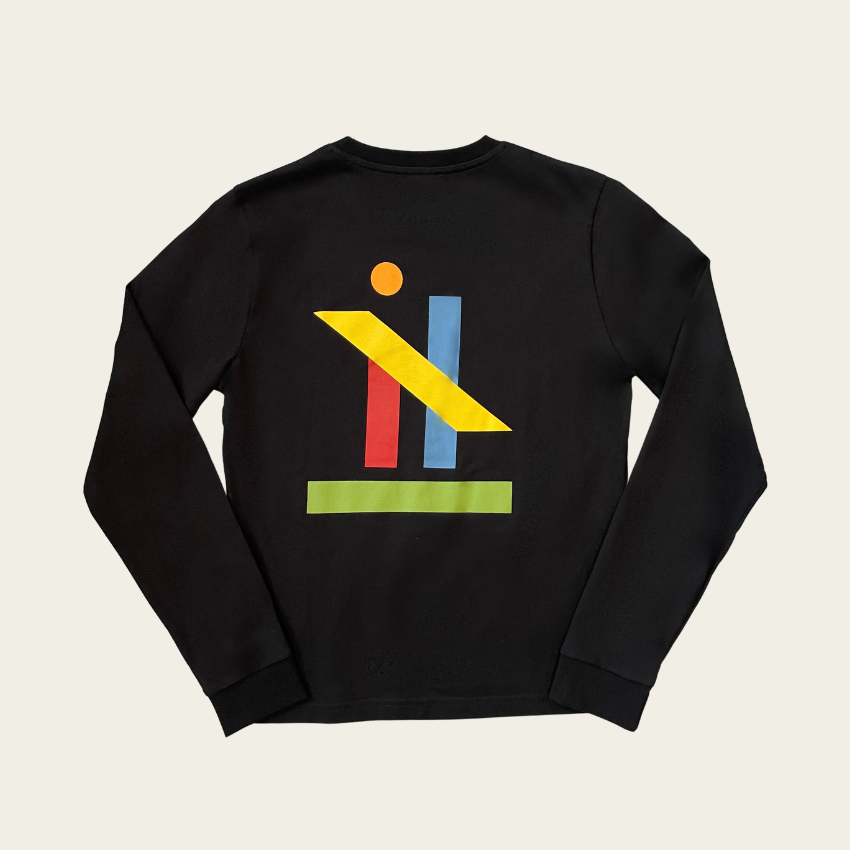 h clothing - flat shot of back of black long sleeved tshirt with graphic of colourful geometric shapes
