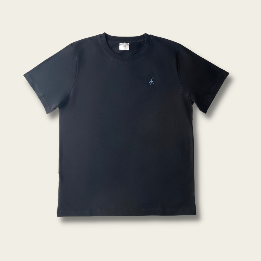 h clothing - flat shot of front of black tshirt with blue h logo on left breast