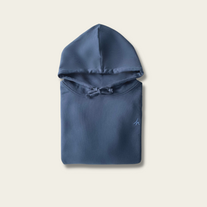 h clothing - flat shot of front of folded navy hoodie with blue h logo on left breast