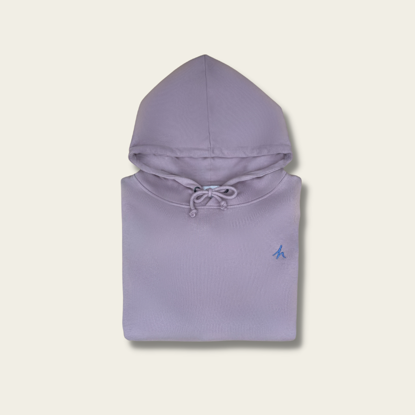h clothing - flat shot of front of folded light purple hoodie with blue h logo on left breast