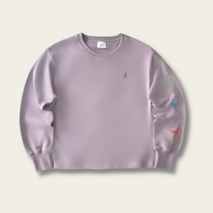h clothing - flat shot of front of light purple sweatshirt with blue h logo on left breast and colourful birds down the left arm