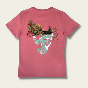 h clothing - flat shot of back of rose tshirt with graphic of a face and a garden on top of the head