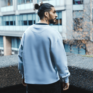 h clothing - male model with back to camera wearing sky blue sweatshirt